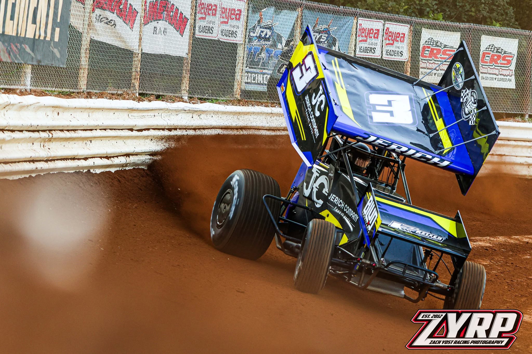 JJR No. 3 sliding off the cushion, wing up, on red clay
